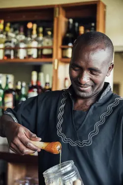 head of bar Patrick Kyalo making a drink