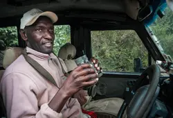 Head Guide Eliziban holding a pair of binoculars